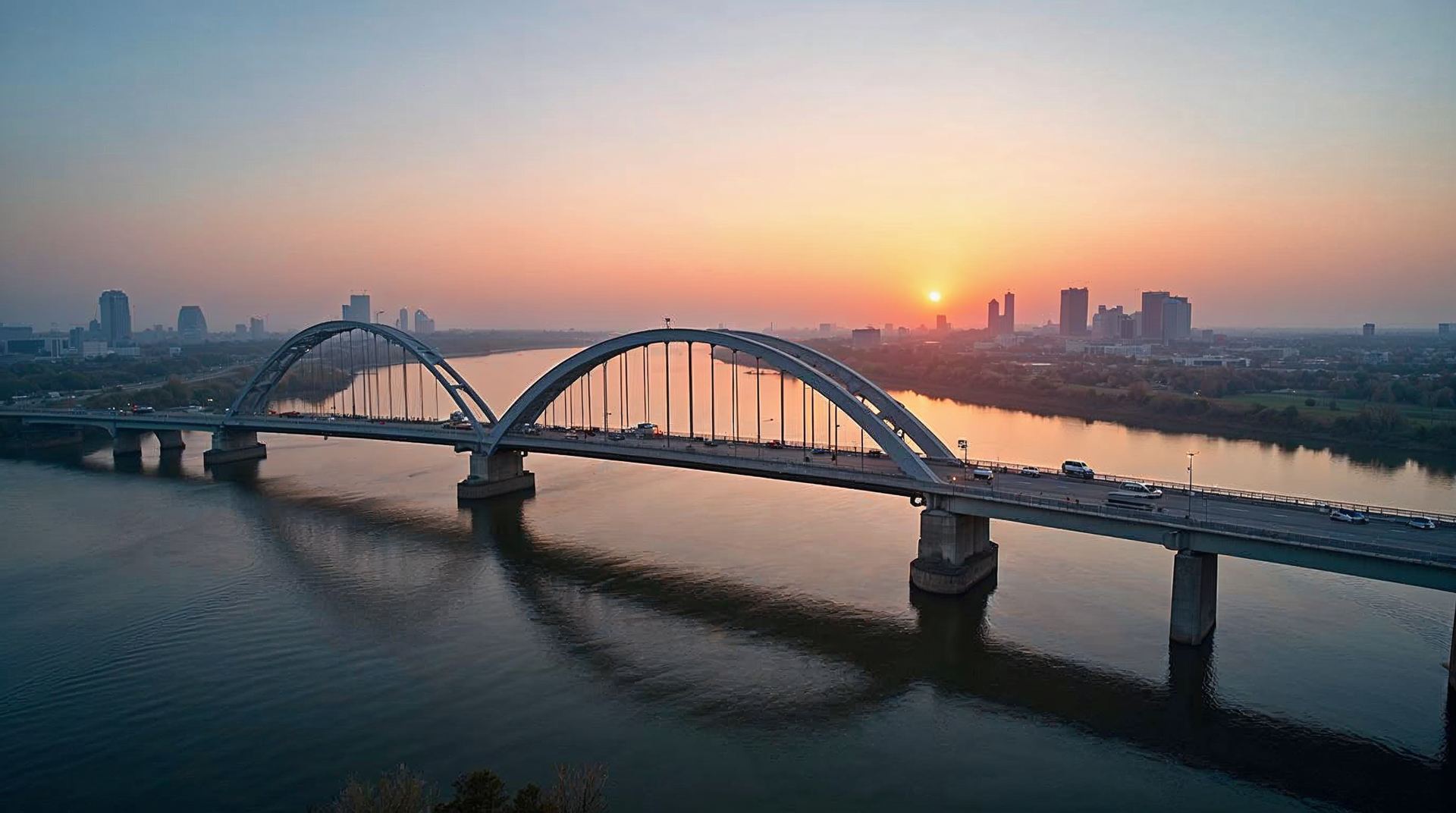 The Bob Kerrey Pedestrian Bridge over the Missouri River at sunset with the Omaha skyline