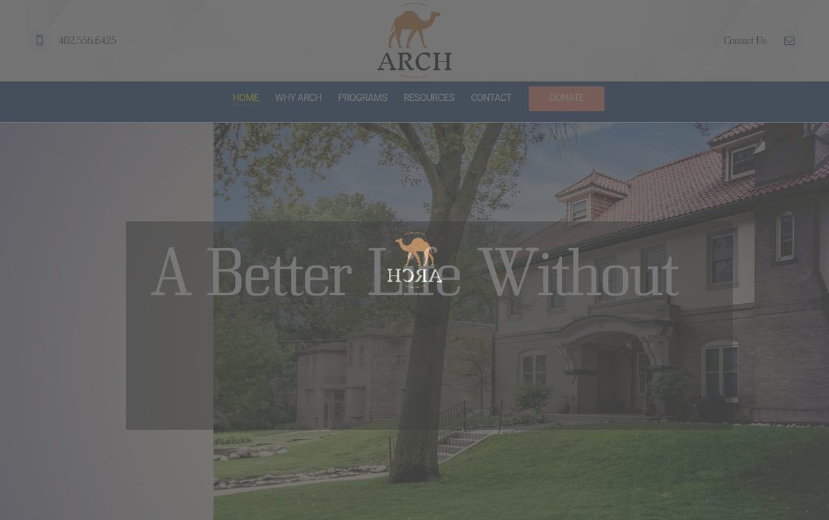Home page of the Arch Halfway House website: Navy and warm stone palette with large hero photo and calm text.