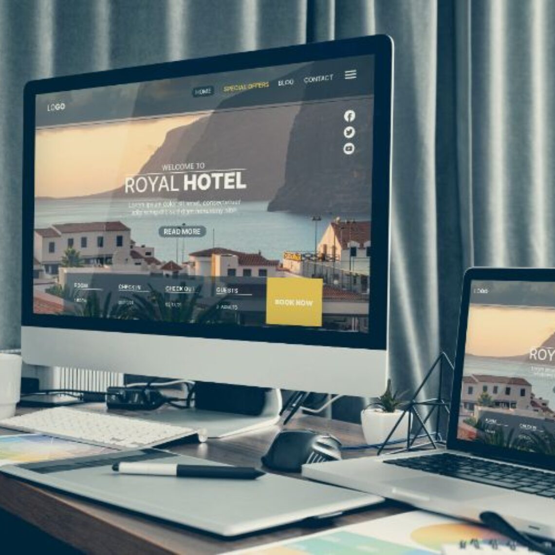 apple desktop and laptop computers sitting on a desk viewing the same website
